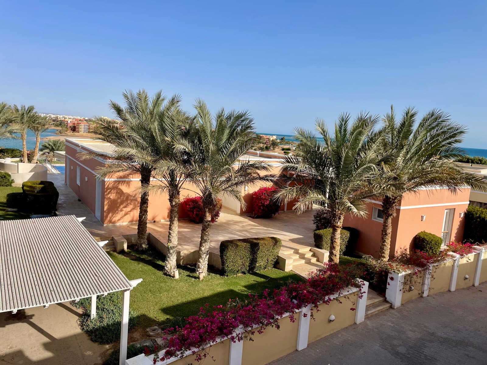 The villa and its garden, sea beyond